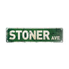 A weathered green metal sign with the text STONER AVE.