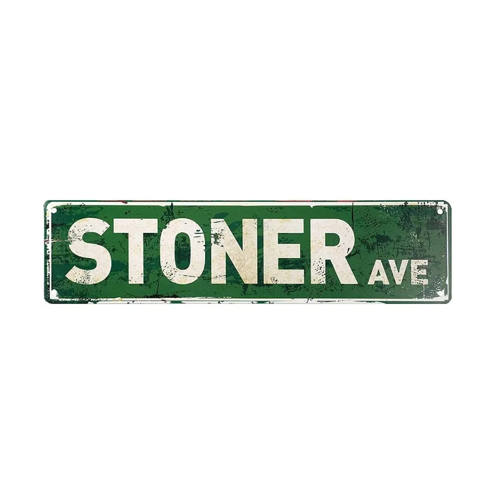 A weathered green metal sign with the text STONER AVE.