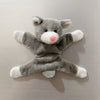 A gray plush toy resembling an elephant with a pink nose, used as a fridge magnet.