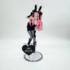 Acrylic keychain set featuring an anime character pendant of a pink-haired girl with black ears and dark clothing.