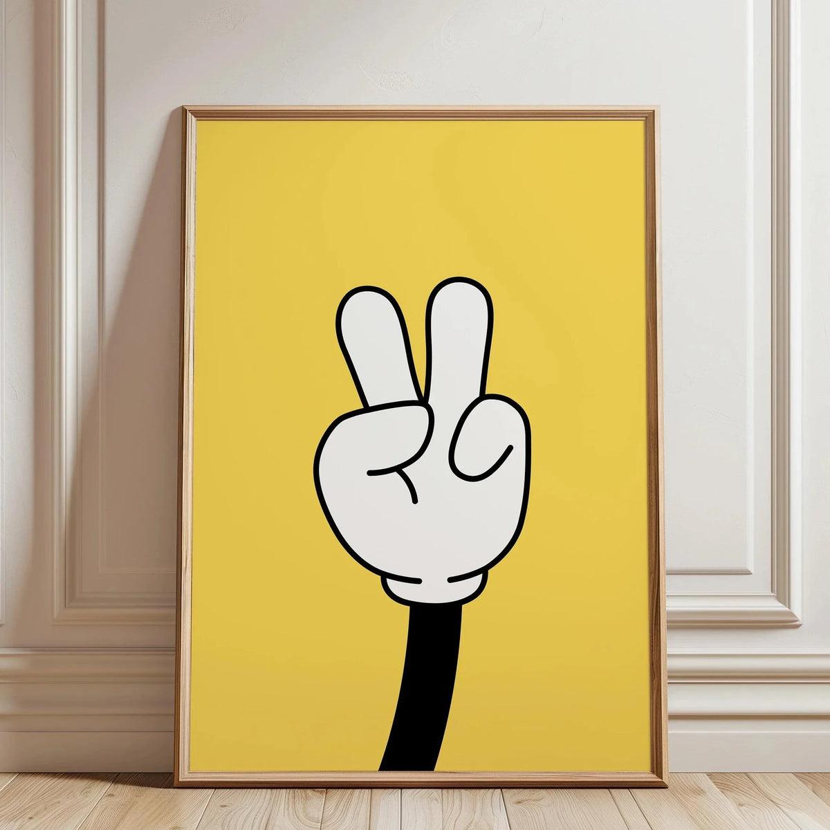 Una pieza de arte enmarcada con un gesto de mano en blanco y negro sobre un fondo amarillo.