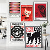 A collection of four vibrant pop art canvas prints featuring cats, abstract shapes, and bold typography on a white wall.