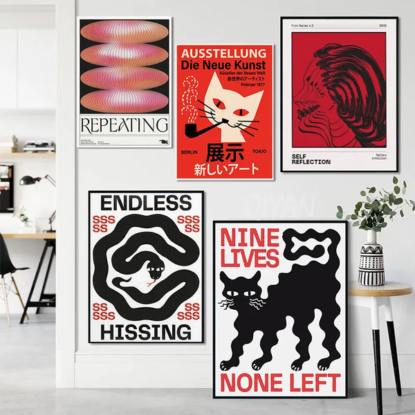 A collection of four vibrant pop art canvas prints featuring cats, abstract shapes, and bold typography on a white wall.