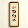 A vertical photo strip frame with a walnut wood border and a yellow gingham background, displaying six portrait photos of a c