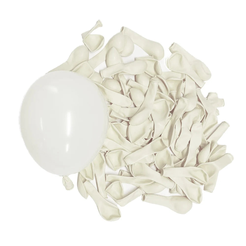 A bunch of pale beige or ivory latex balloons scattered on a white background.