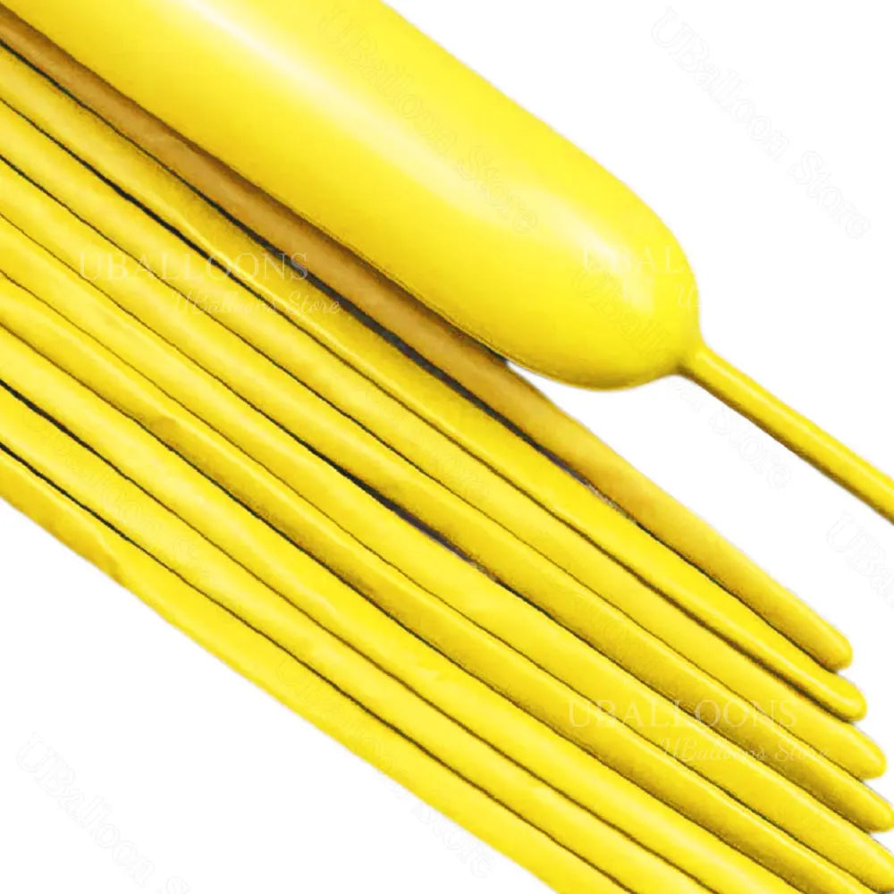 A close-up of yellow magic twisting balloons arranged in a fan shape.