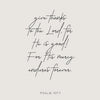 A black script rendering of Psalm 107:1 on a light gray background.