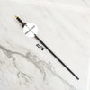 A black metal magic wand replica with a gold tip and a 40cm length is displayed on a white marble surface.