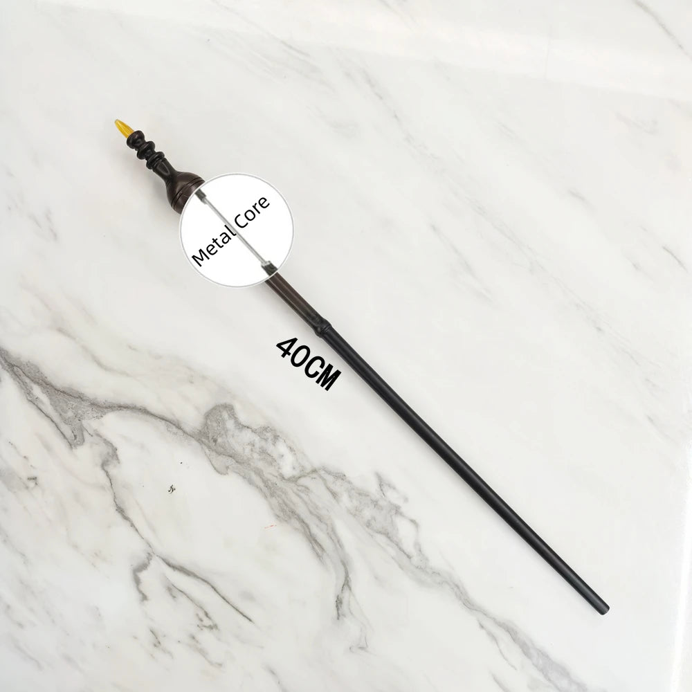 A black metal magic wand replica with a gold tip and a 40cm length is displayed on a white marble surface.