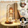 Elegant gold candle warmer lamp with adjustable height illuminating a white candle on a wooden base
