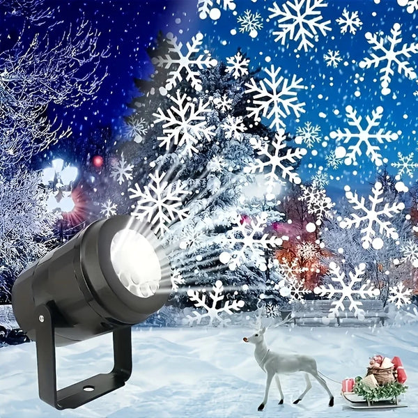 A black USB rotating LED snowflake projection light illuminates a snowy outdoor scene with falling snowflakes and a deer.