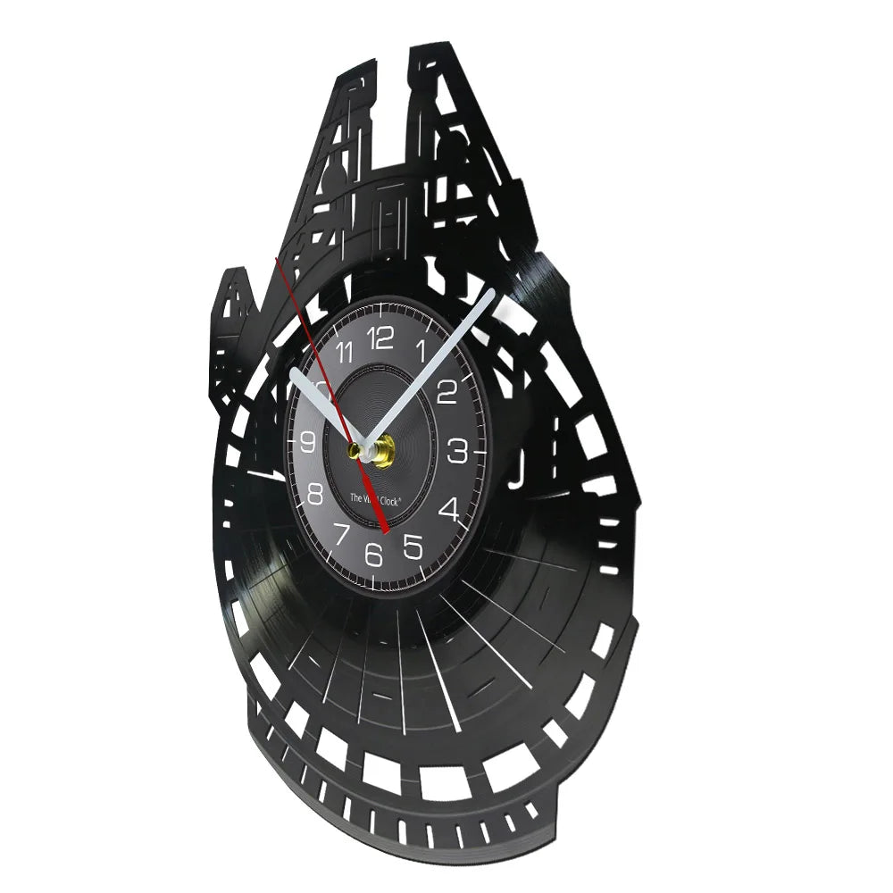 A black vinyl record wall clock with a white face and black markings, showing the time.