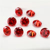 A collection of various round and triangular red gemstone loose stones for jewelry making.