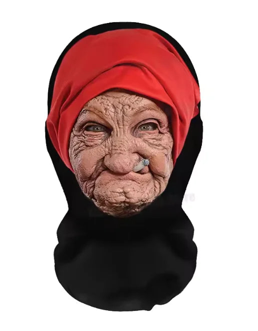 A close-up portrait of an elderly woman wearing a red headscarf mask.
