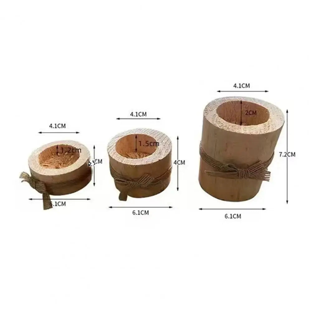 A set of rustic wooden stump candle holders with various diameters and lengths.