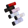 A collection of red and pink hand twist confetti cannons for parties.