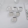A set of ten mirror-finish mini trays for jewelry, snacks, and decor arranged on a white surface.
