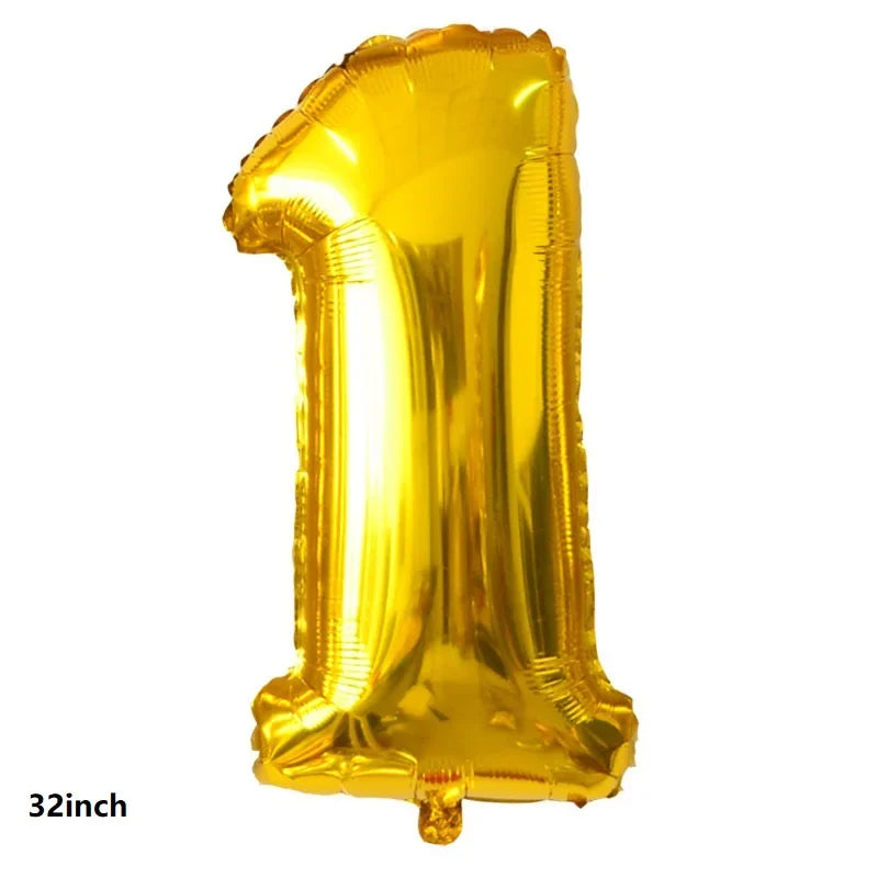 A shiny gold foil balloon shaped like the number one