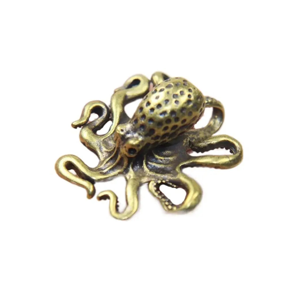 Antique brass octopus desk ornament with detailed texture and tentacles