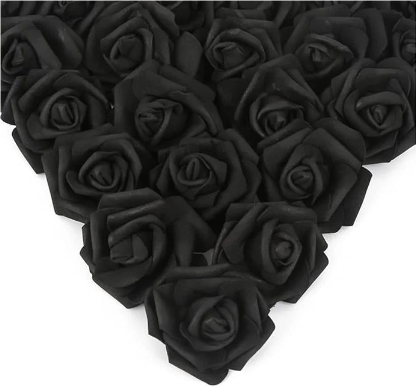 A dense arrangement of black artificial foam rose decorations.