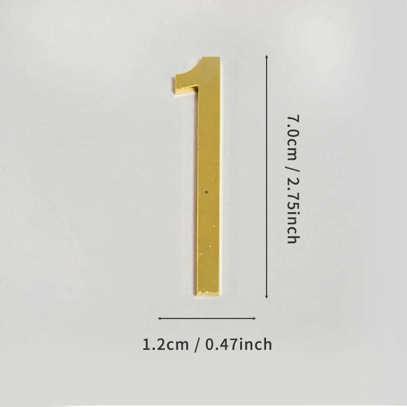 A polished gold house number with a vertical design and self-adhesive backing.