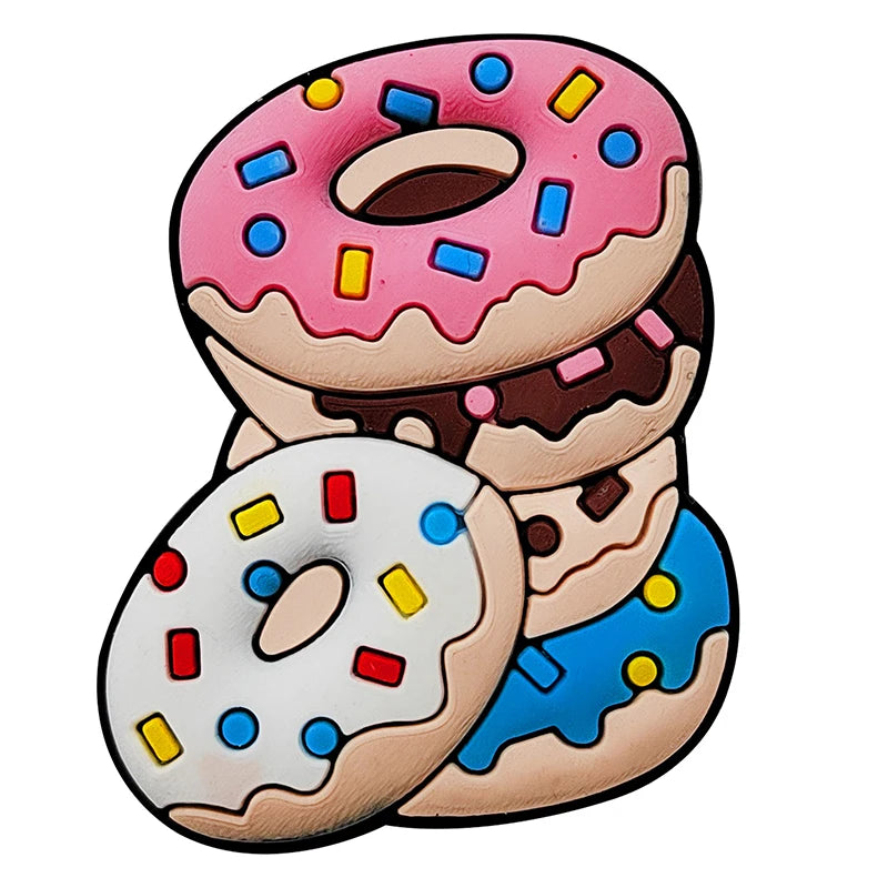 A pair of pink and white glazed doughnut charms for Crocs or slides.