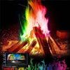A vibrant, colorful fire display with flames in green, yellow, orange, and red against a dark background.