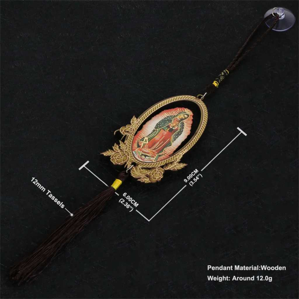 A wooden Our Lady of Guadalupe pendant charm with a gold-colored frame and tassel on a black background.