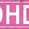 A pink distressed metal sign with white text reading ADHD AVE