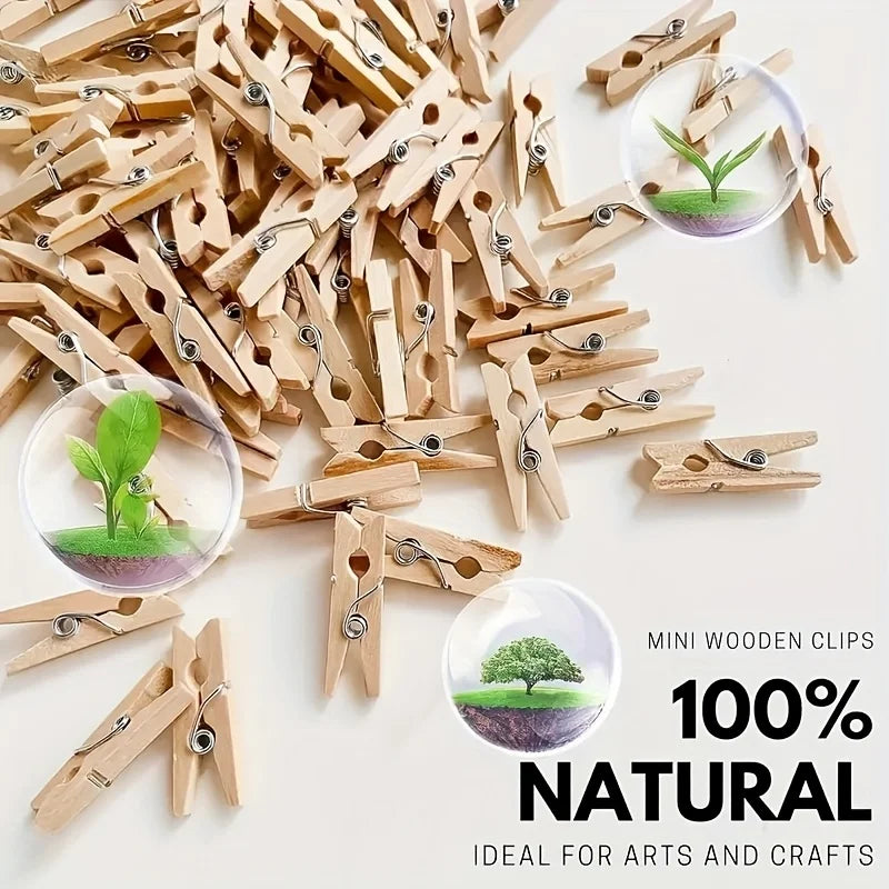 A pile of natural wooden mini clothespins with small plants attached, suitable for arts and crafts.