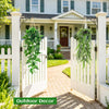 A set of four realistic hanging artificial ivy vines displayed in white wooden gates and a garden setting.