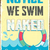A vintage tin sign with blue and white text that reads NOTICE WE SWIM NAKED Our Pool Our Rules