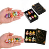 A hand holds several colorful Halloween witch mini dwarf resin figurines and a decorative box.