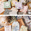 A collection of vintage paper packs featuring floral and nature patterns for junk journals and scrapbooking.