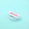 A clear silicone replacement lid with a white and pink color design for a tumbler cup.