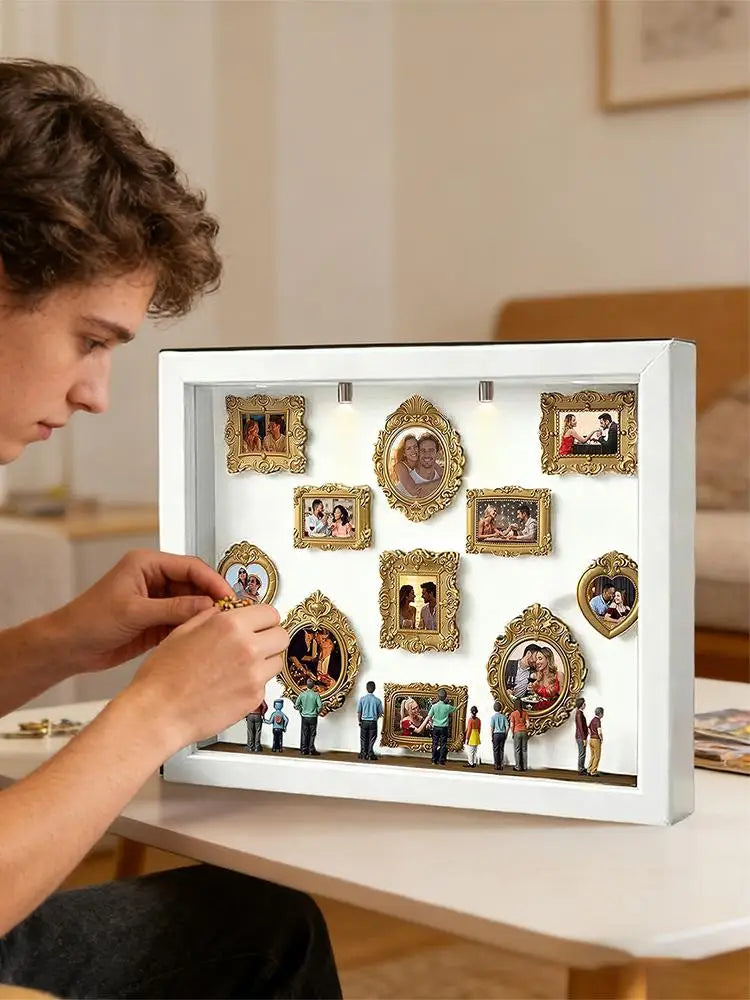 A white display case featuring gold-framed photos and figurines illuminated by LED lights.