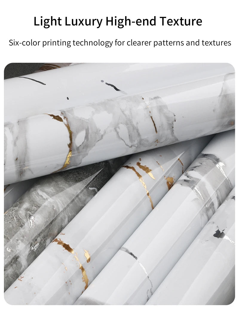 Rolls of white marble contact paper featuring gray veining and gold accents for DIY decor