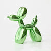 A shiny green resin balloon dog sculpture with a whimsical design.