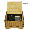 A wooden music box featuring an anime character design and a small mechanical component.
