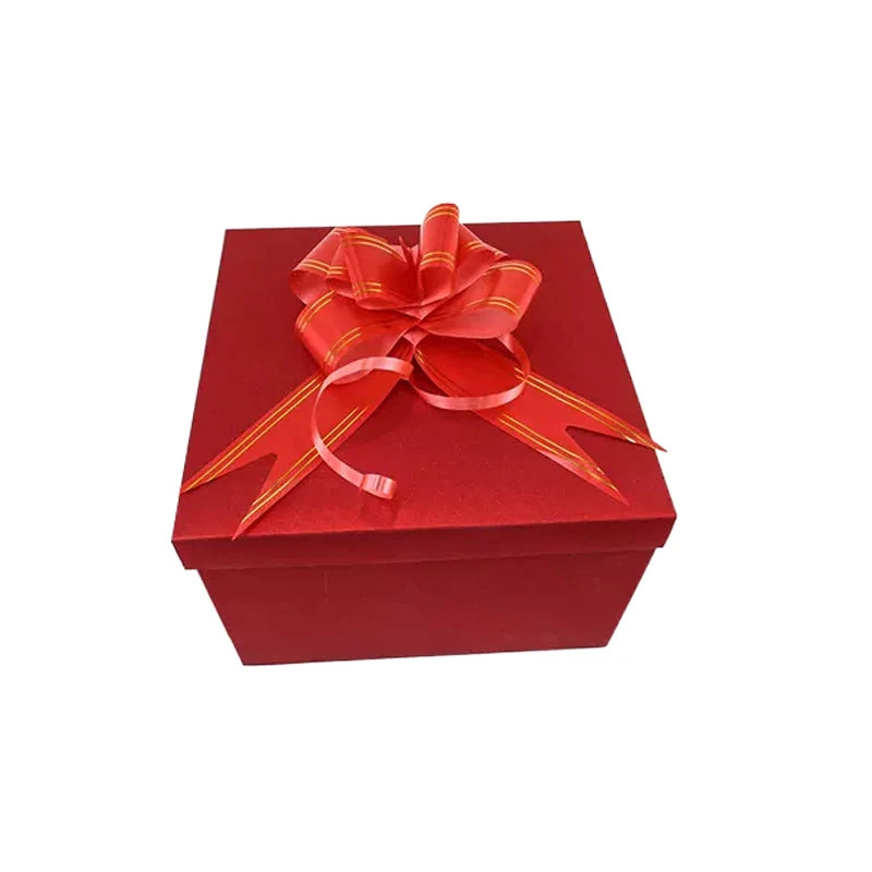 A red gift box with a satin orange ribbon tied in a bow.