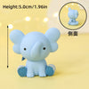 A light blue elephant figure used as a cake topper for safari birthday parties.