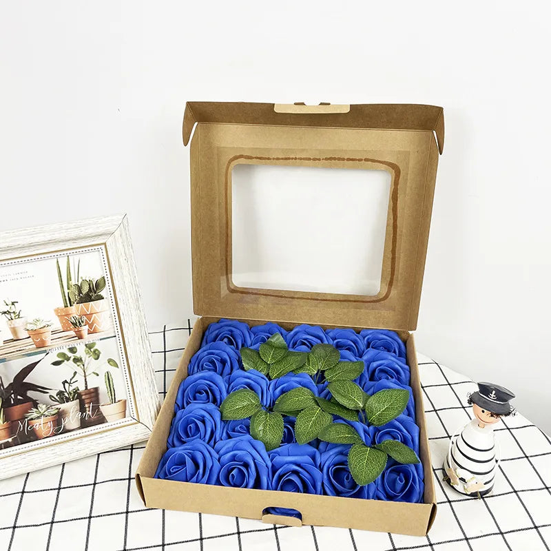 A box containing thirty artificial blue rose flowers with stems displayed on a white surface.