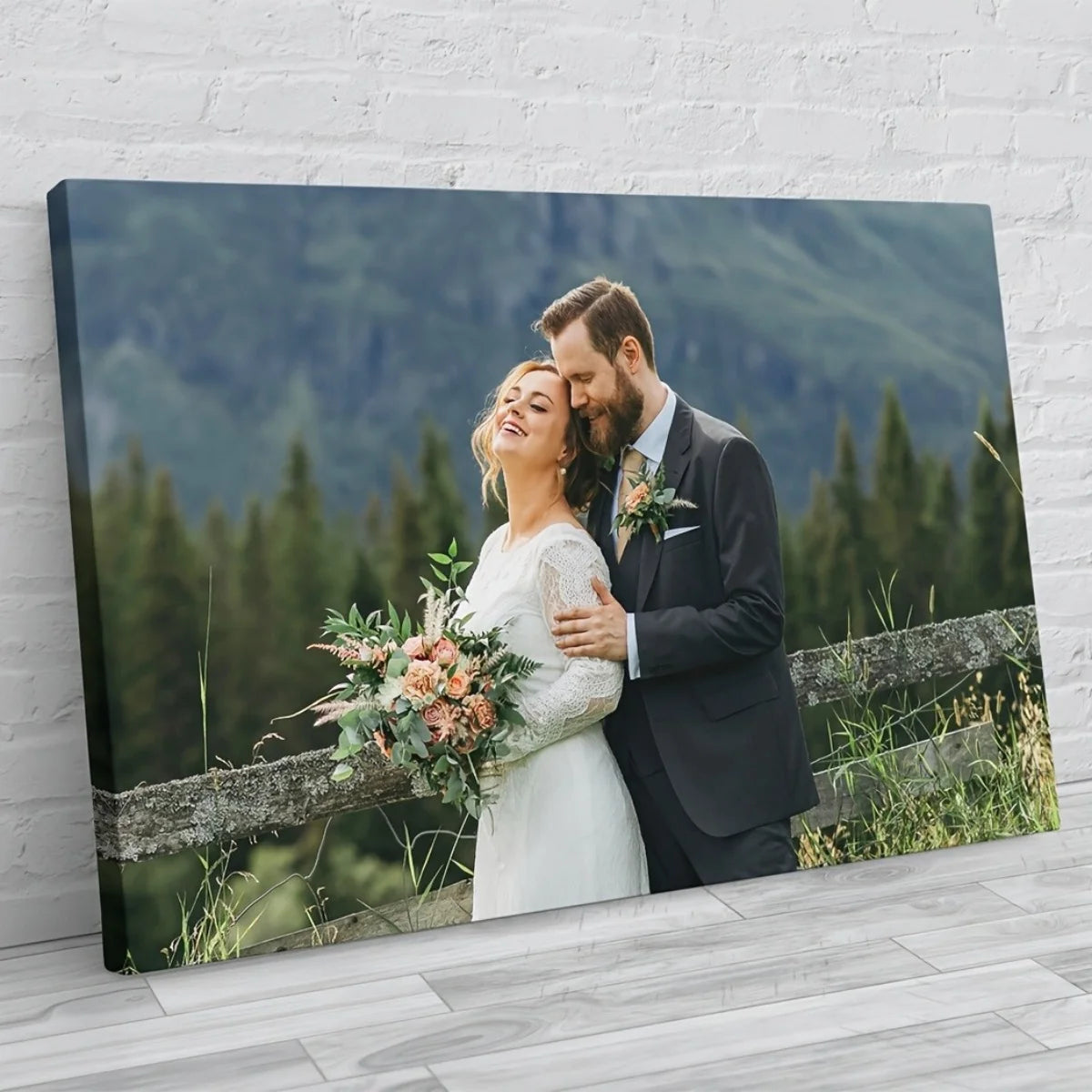 A portrait of a couple embracing outdoors with a blurred green forest background.