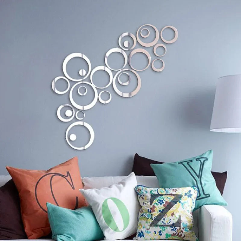 A decorative wall piece featuring a cluster of circular acrylic mirror stickers in various sizes and rose gold tones.