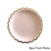 Eight 7-inch pink plates with gold scalloped edges for a disposable party set
