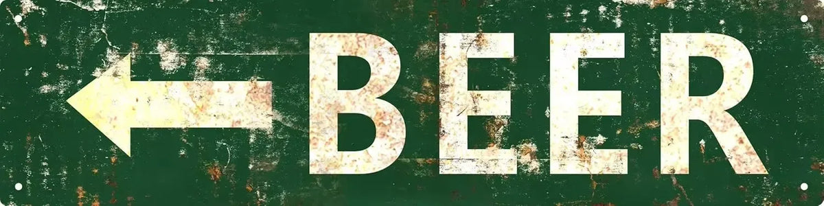 A distressed green metal sign with a white arrow pointing left and the word BEER.