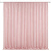 A floor-to-ceiling pink pleated drapery backdrop used for weddings and parties.