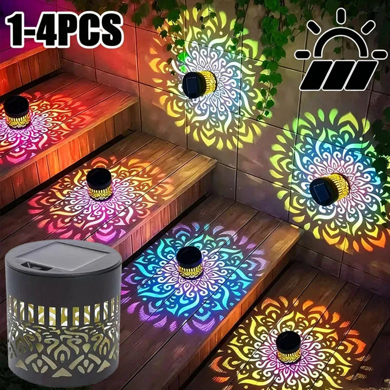 Four solar-powered mandala wall lanterns illuminating a wooden deck and garden area.