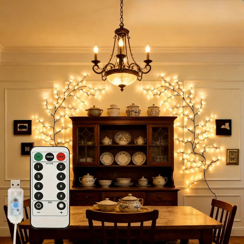 A dining room setting featuring a wooden table and sideboard decorated with flexible willow branch LED lights.