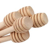 A set of ten natural wood honey dipper sticks with ribbed ends.